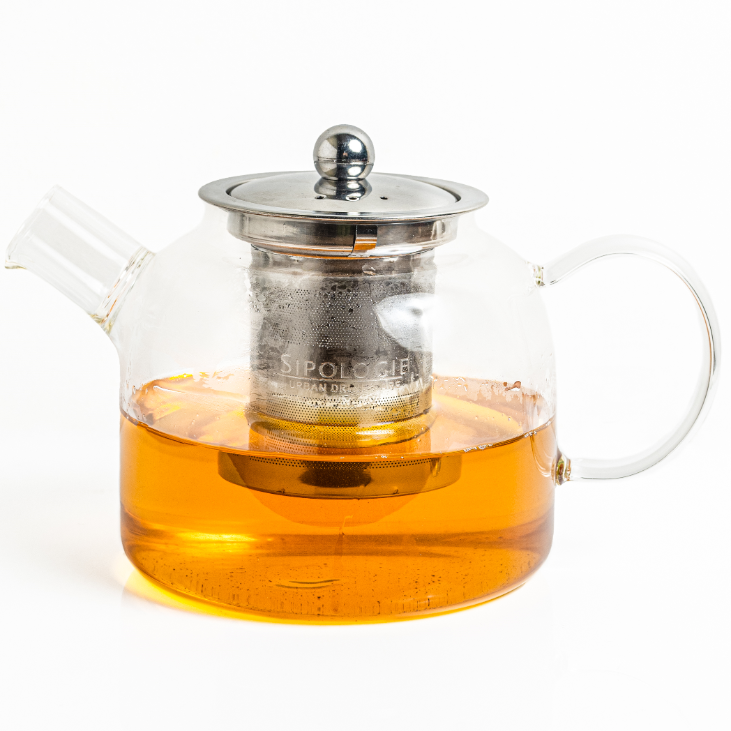 A clear glass tea pot with a detachable stainless steel infuser inside, partially filled with tea, on a white background.