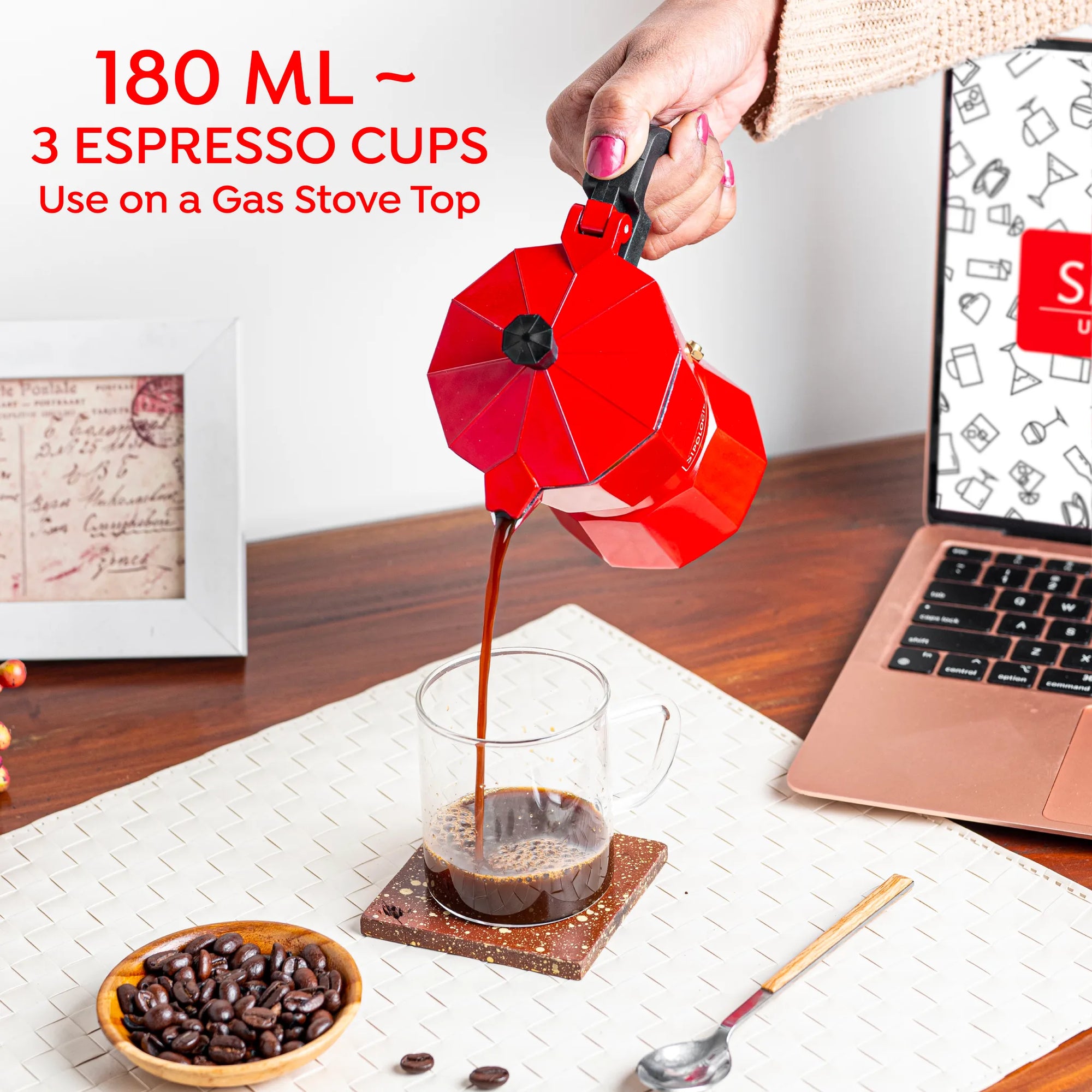 Fresh espresso being poured from a Sipologie 180ml red Moka Pot into a glass