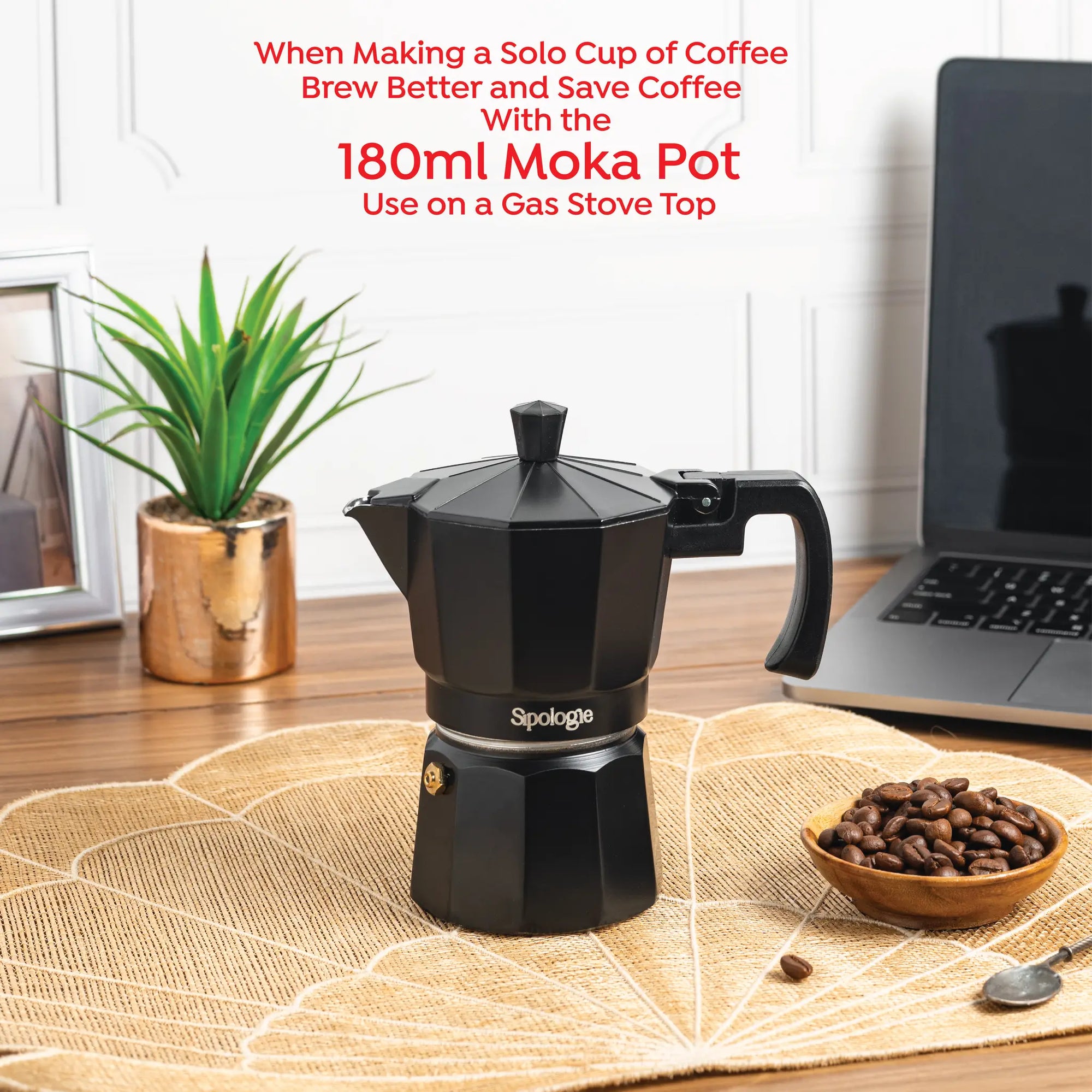 A black Sipologie 180ml moka pot sits on a woven placemat on a wooden table, with a laptop, a small potted plant, and a bowl of coffee beans in the background. Red text at the top reads, 'When Making a Solo Cup of Coffee Brew Better and Save Coffee With the 180ml Moka Pot Use on a Gas Stove Top'.