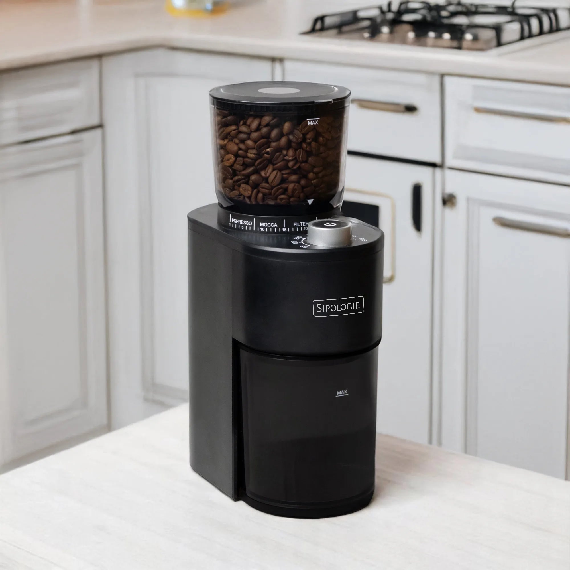 Black coffee grinder with coffee beans on a kitchen counter