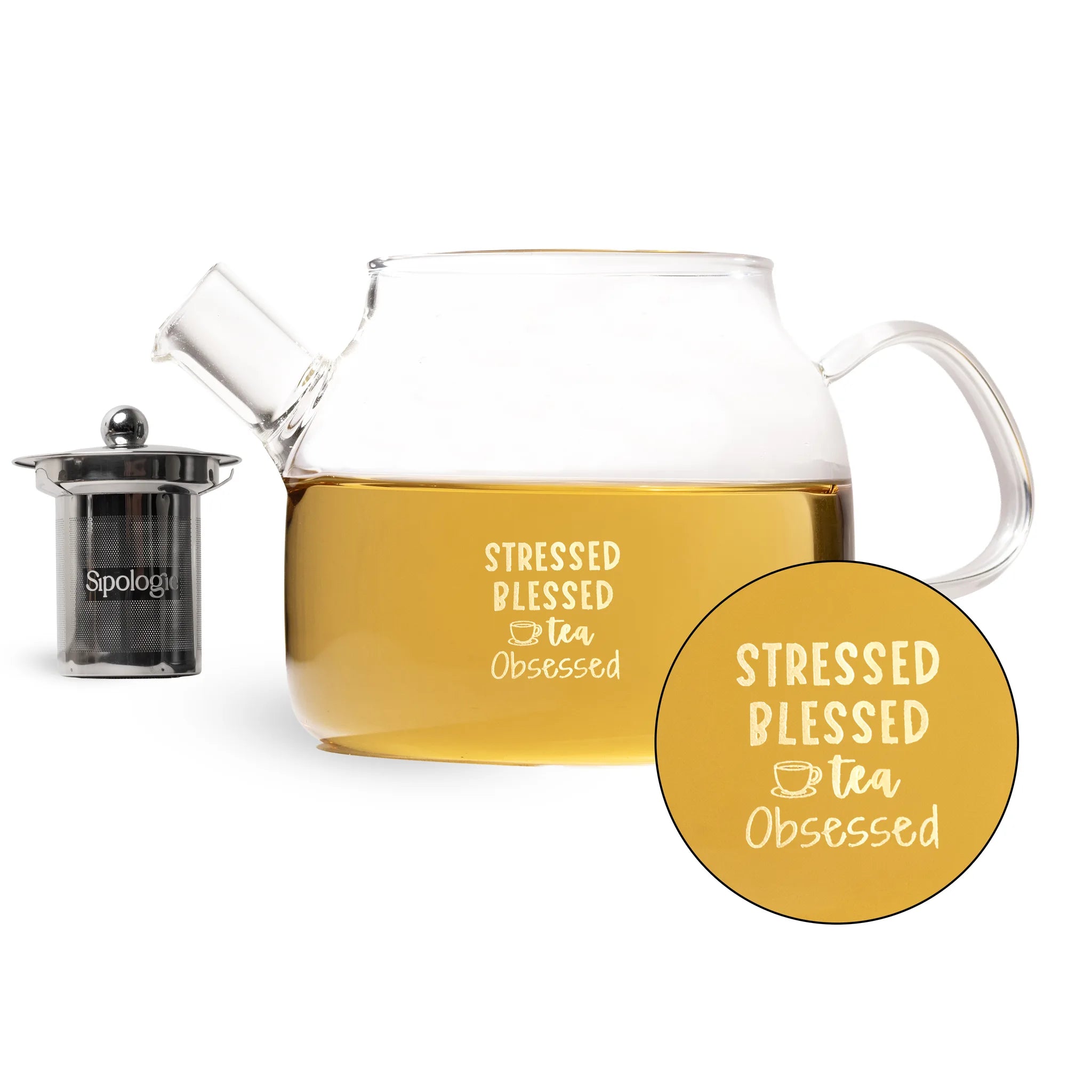 A clear glass teapot filled with tea, shown on a white background with a small dark infuser filter and a circular close-up of the printed phrase 'Stressed Blessed Tea Obsessed' on the teapot and in the overlay.