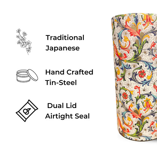 A decorative cylindrical tin with a colorful traditional Japanese floral scroll pattern on a light background, shown next to feature callouts reading 'Traditional Japanese,' 'Hand Crafted Tin-Steel,' and 'Dual Lid Airtight Seal.'.