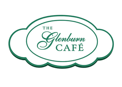 A green and white cloud-shaped sign reading 'THE Glenburn CAFÉ' on a plain white background.