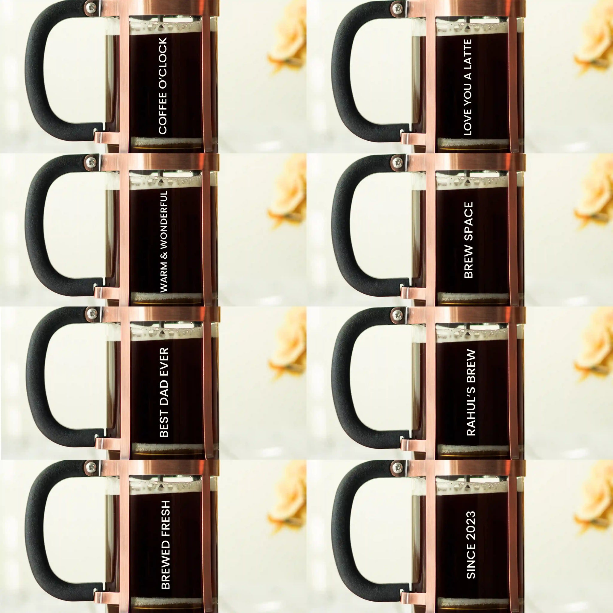 Six stacked glass mugs with black handles and rose gold metal rims, each printed with a different coffee-themed phrase on a light background with small lemon slices.